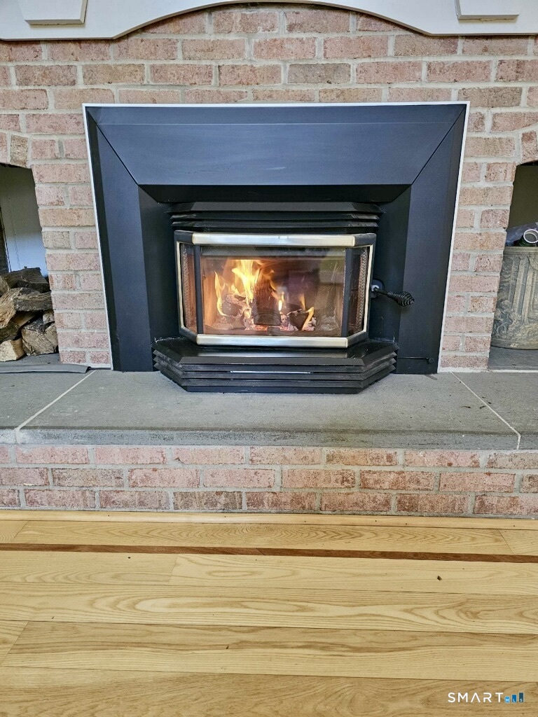 455 Chesterfield Road Montville, CT 06370 - Photo 36 of 40 a living room with a fireplace