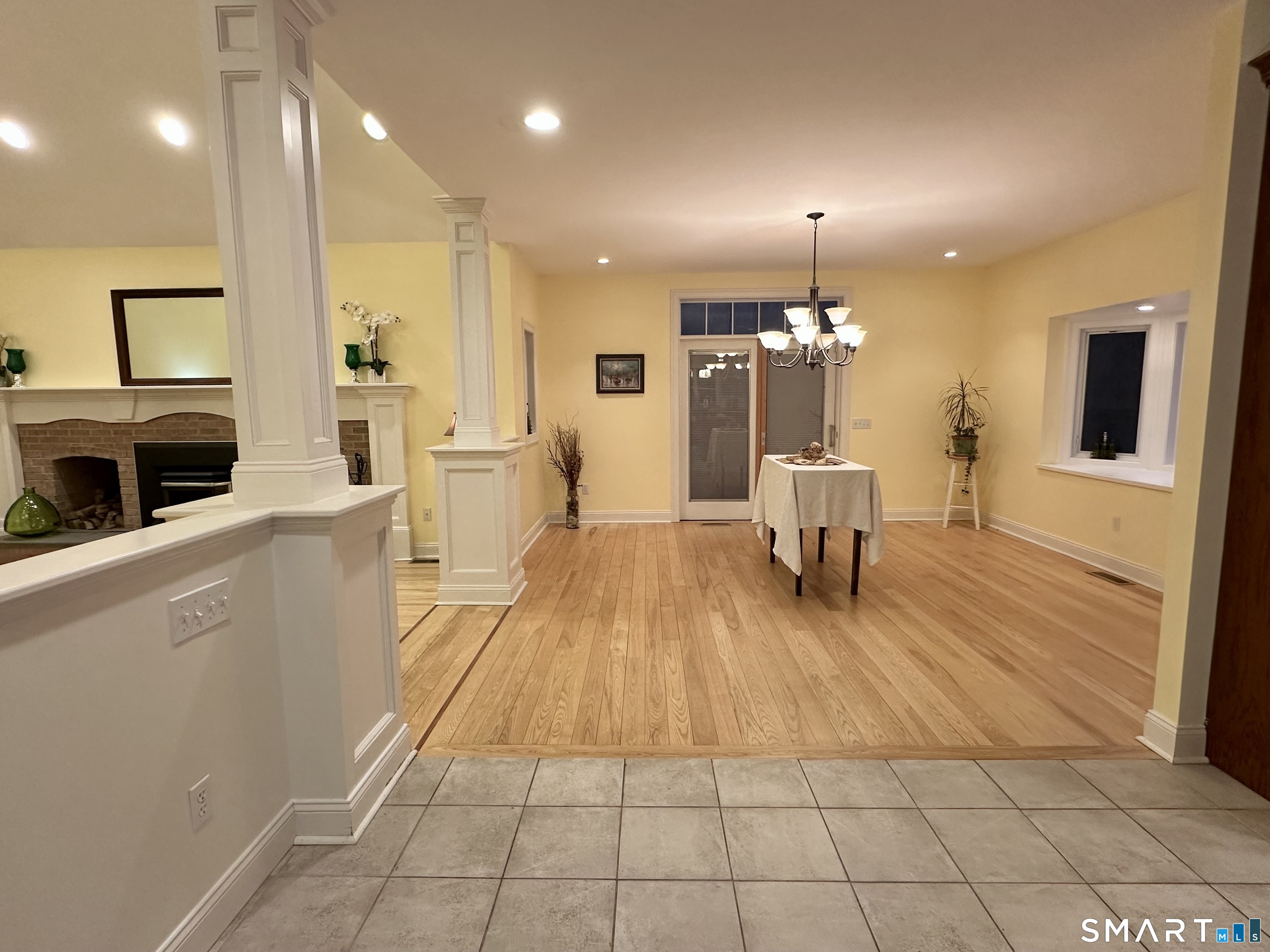 455 Chesterfield Road Montville, CT 06370 - Photo 8 of 40 a kitchen with stainless steel appliances a dining table chairs stove and cabinets