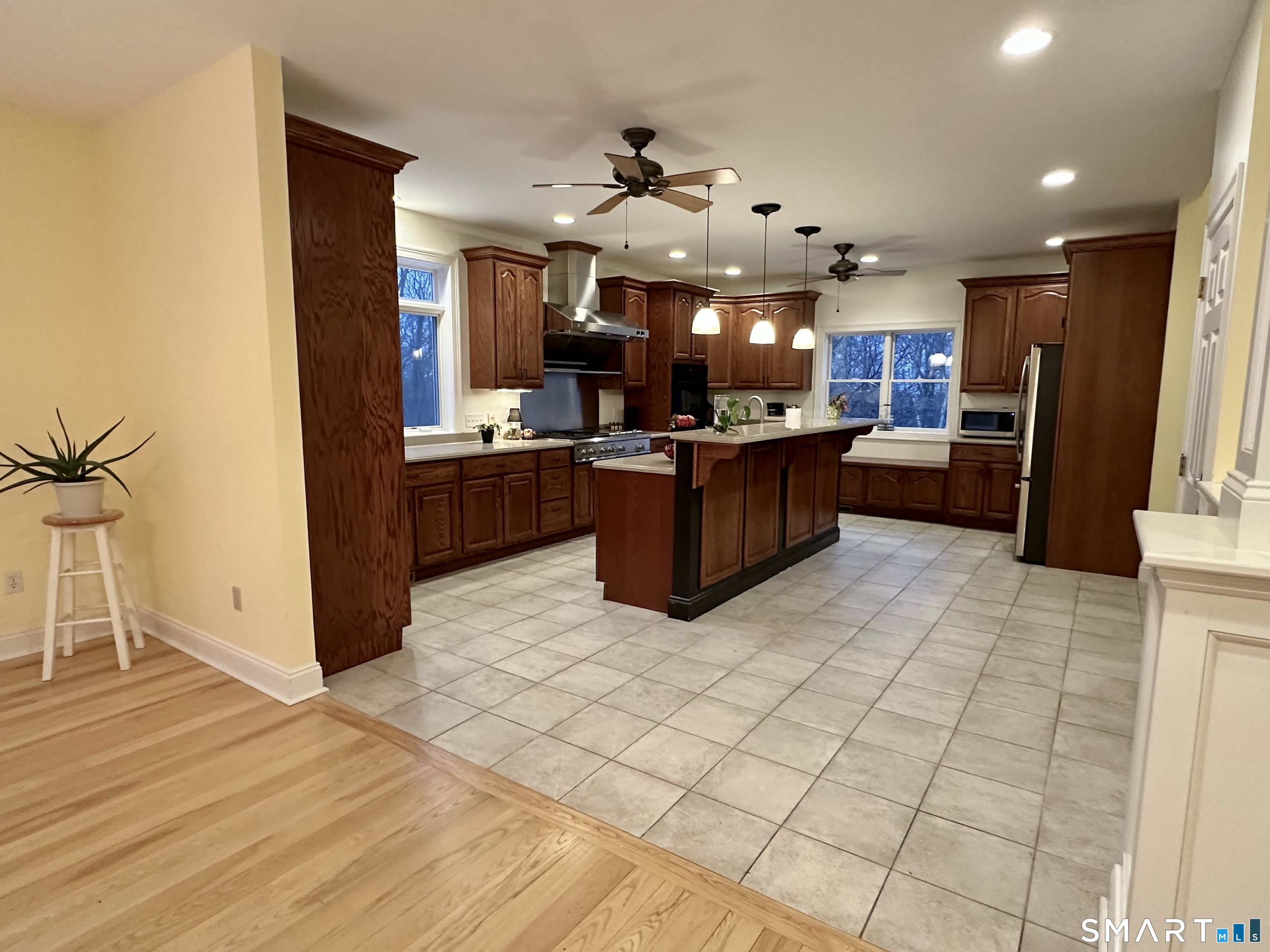 455 Chesterfield Road Montville, CT 06370 - Photo 9 of 40 a kitchen with stainless steel appliances kitchen island granite countertop a refrigerator a stove top oven and a sink