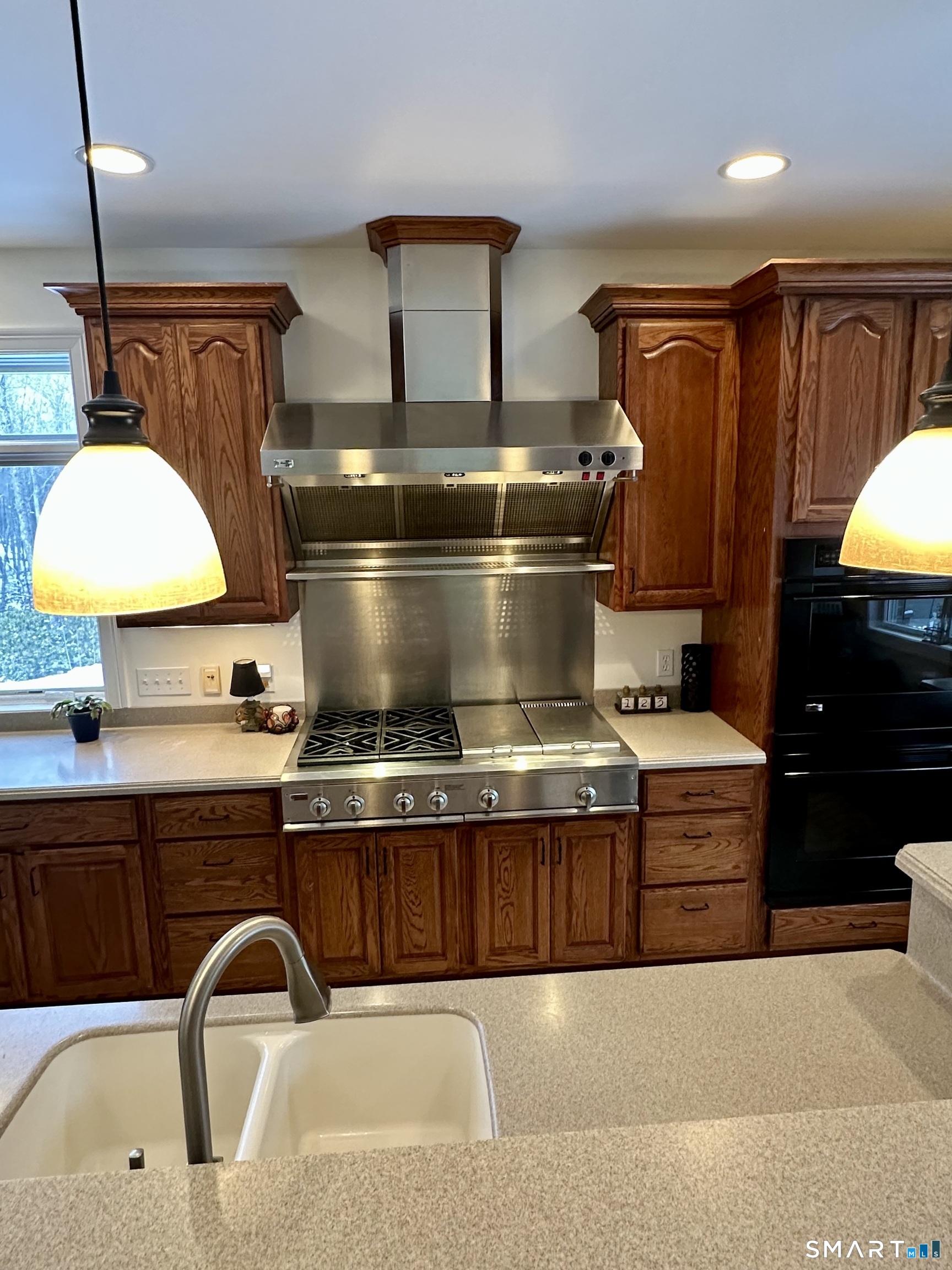 455 Chesterfield Road Montville, CT 06370 - Photo 10 of 40 a kitchen with a stove and a sink