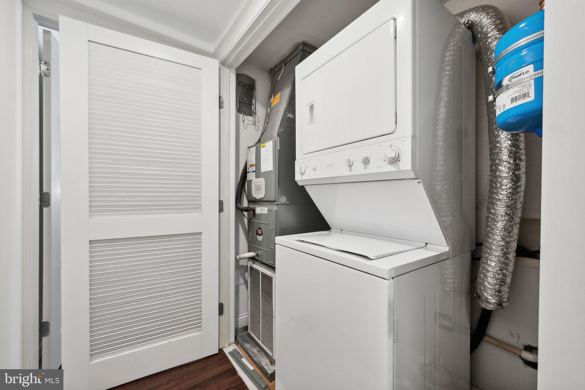 1354 Euclid Street Northwest, Unit 101B Washington, DC 20009 - Photo 14 of 15 a utility room with dryer and washer
