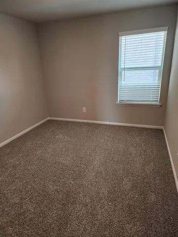 a view of washer and dryer with wooden floor