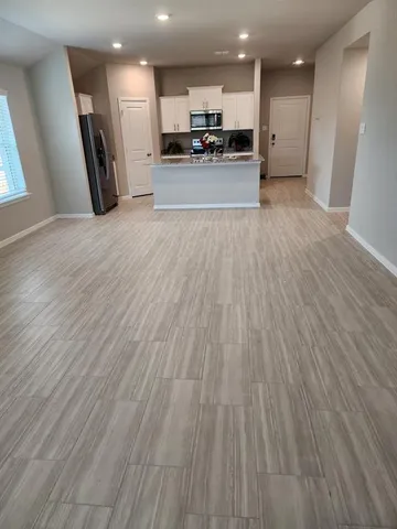 a view of an empty room and window