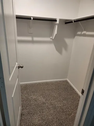 a bathroom with a toilet a sink and shower