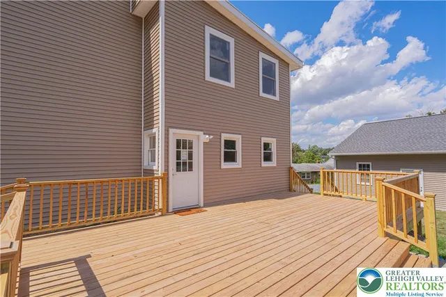 a view of a house with a barbeque