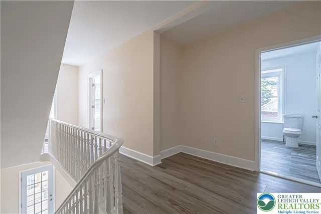 a view of entryway with wooden floor