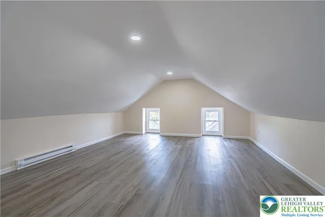 a view of an empty room and wooden floor