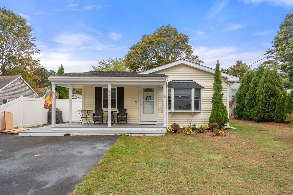 front view of a house with a chairs
