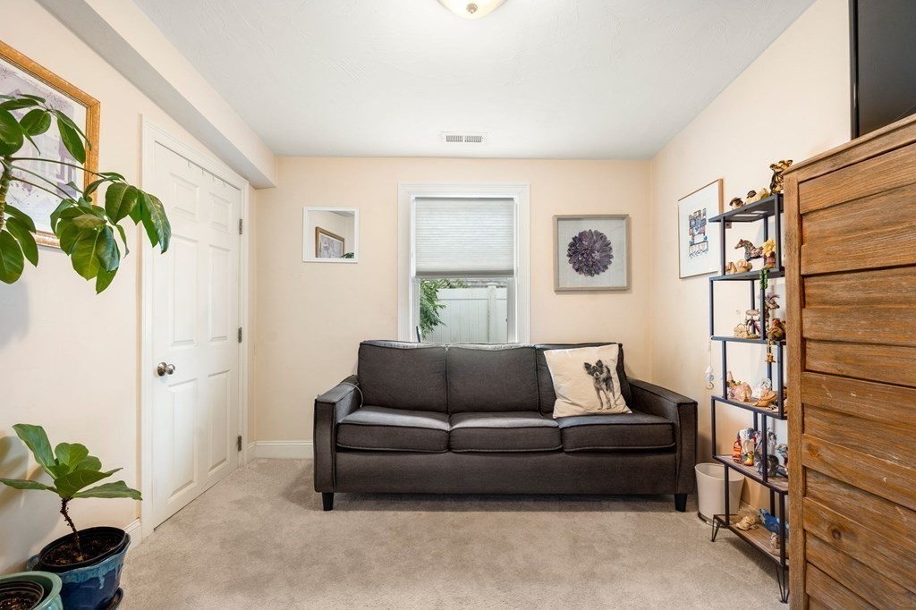 16 Monack Road Wareham, MA 02532 - Photo 15 of 24 a living room with furniture and a potted plant