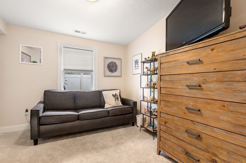 16 Monack Road Wareham, MA 02532 - Photo 16 of 24 a living room with furniture and a flat screen tv