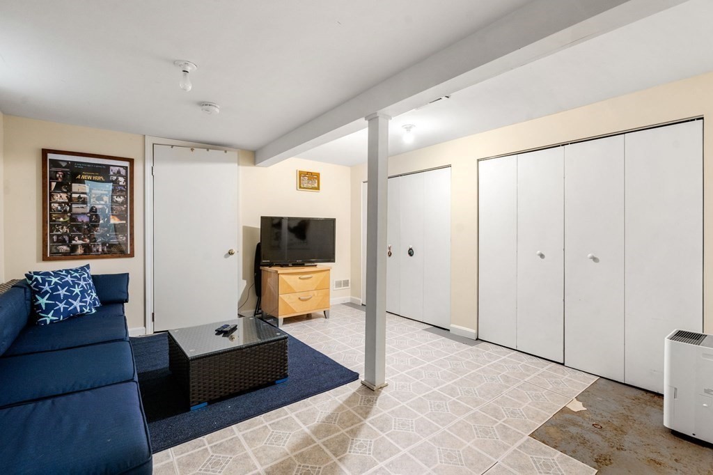 16 Monack Road Wareham, MA 02532 - Photo 19 of 24 a living room with furniture and a flat screen tv