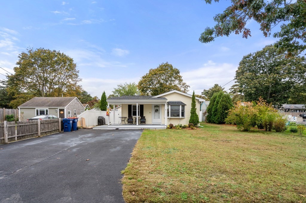 16 Monack Road Wareham, MA 02532 - Photo 2 of 24 a view of a house with a big yard and large trees