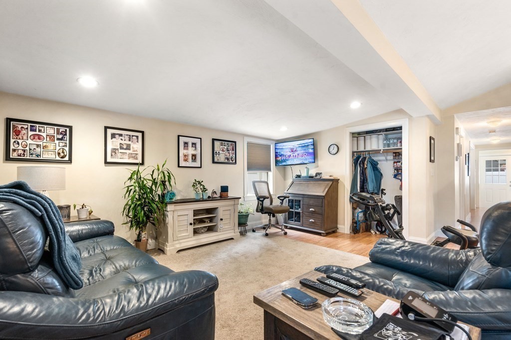 16 Monack Road Wareham, MA 02532 - Photo 5 of 24 a living room with furniture and a flat screen tv