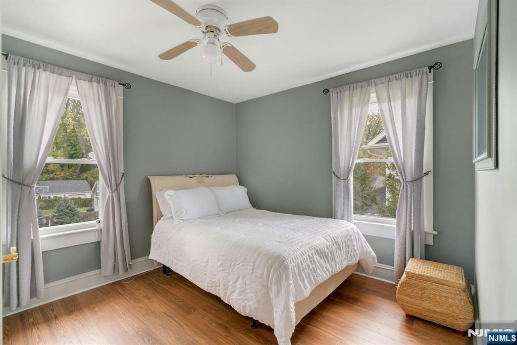 409 Warren Avenue Ho-Ho-Kus, NJ 07423 - Photo 12 of 23 a bedroom with a bed and wooden floor