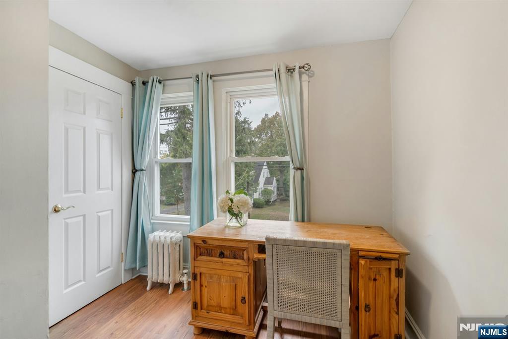 409 Warren Avenue Ho-Ho-Kus, NJ 07423 - Photo 13 of 23 a dining room with furniture and wooden floor