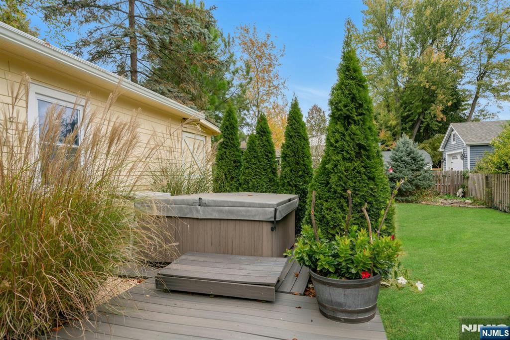 409 Warren Avenue Ho-Ho-Kus, NJ 07423 - Photo 19 of 23 a view of a backyard with sitting area