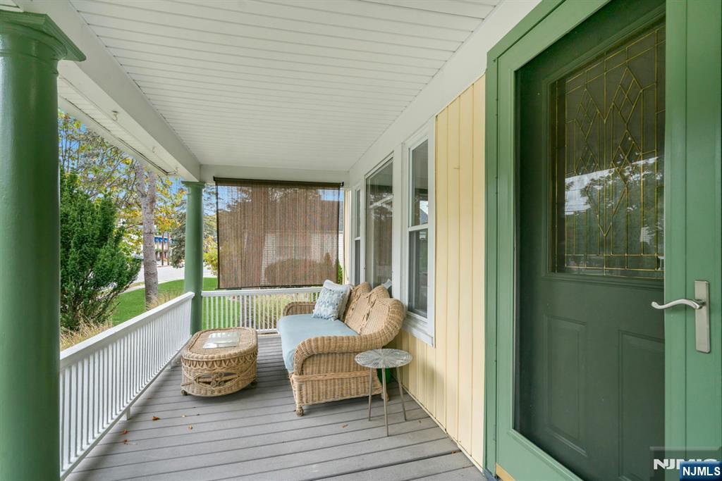 409 Warren Avenue Ho-Ho-Kus, NJ 07423 - Photo 3 of 23 a balcony with wooden floor and furniture