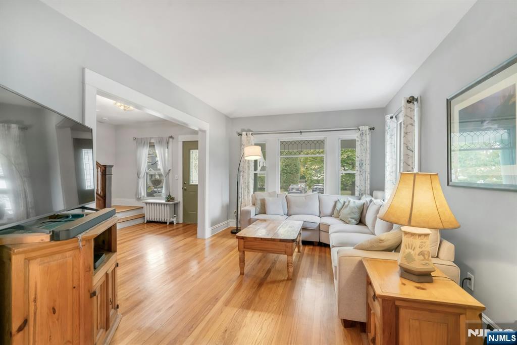 409 Warren Avenue Ho-Ho-Kus, NJ 07423 - Photo 6 of 23 a living room with furniture and a flat screen tv