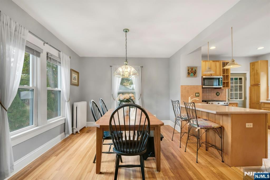 409 Warren Avenue Ho-Ho-Kus, NJ 07423 - Photo 7 of 23 a view of a dining room with furniture window and wooden floor