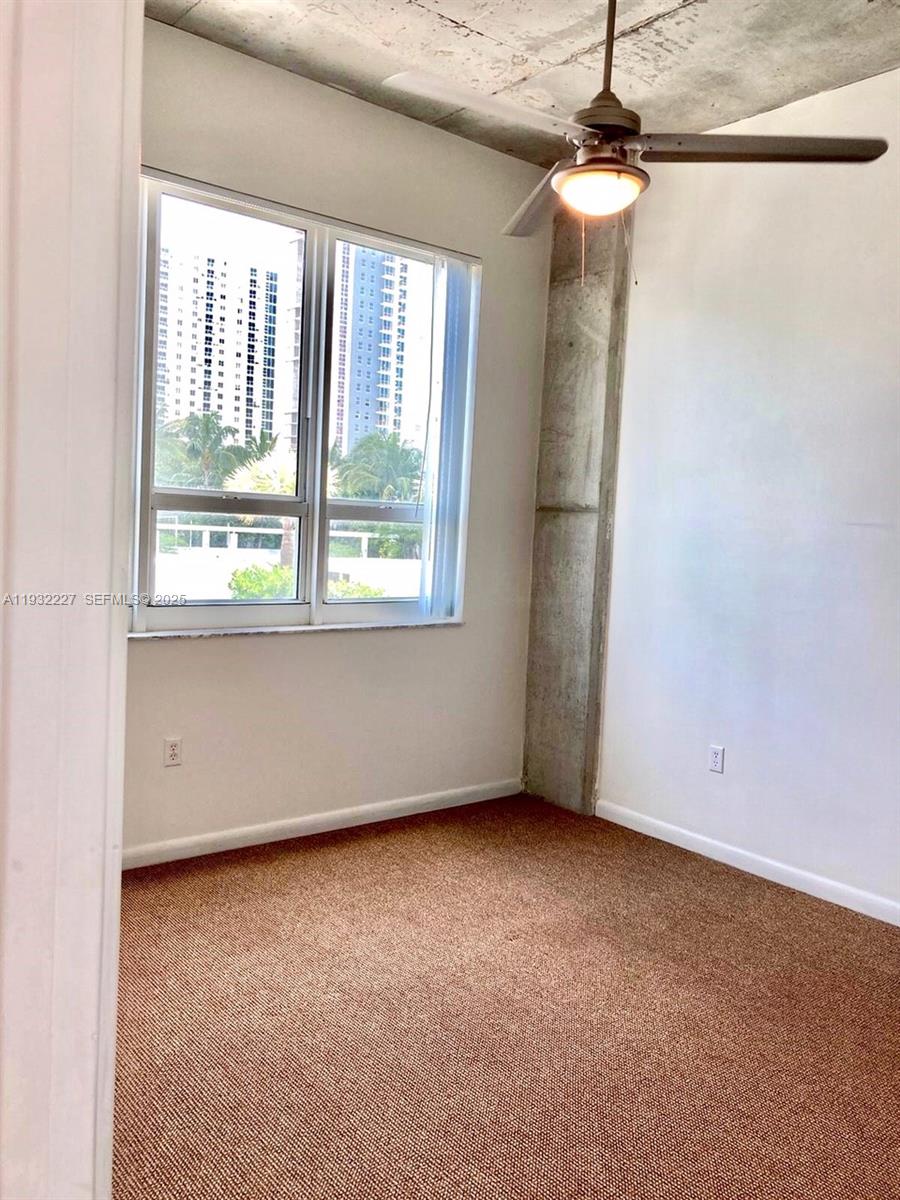 2001 Biscayne Boulevard, Unit 2608 Miami, FL 33137 - Photo 4 of 10 an empty room with a window