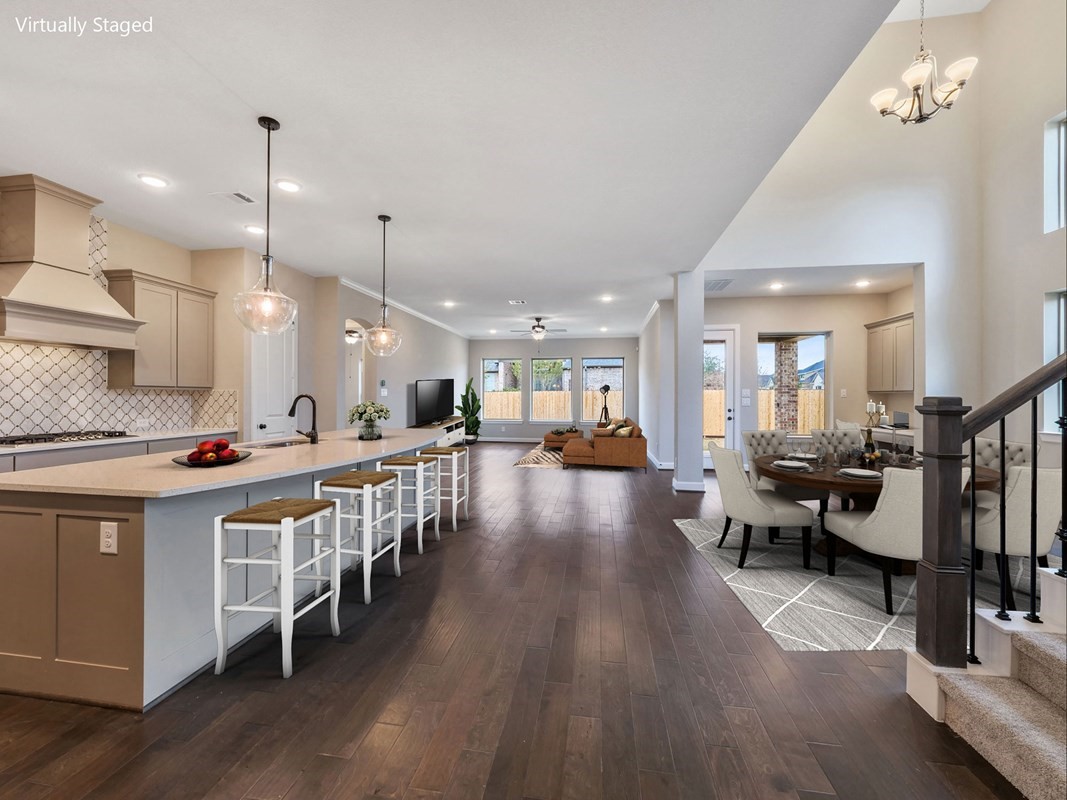 3308 Bentwood Ranch Drive Conroe, TX 77385 - Photo 2 of 24 a open kitchen with stainless steel appliances granite countertop lots of counter top space