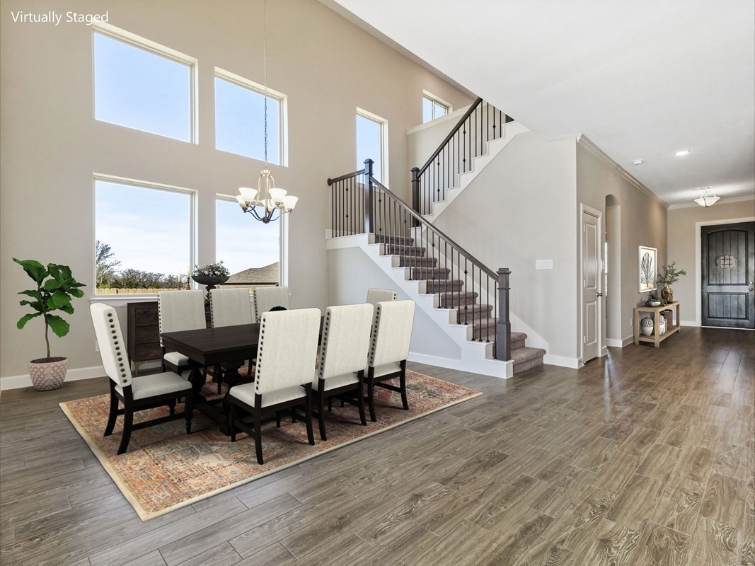 3308 Bentwood Ranch Drive Conroe, TX 77385 - Photo 4 of 24 a view of a dining room with furniture and wooden floor