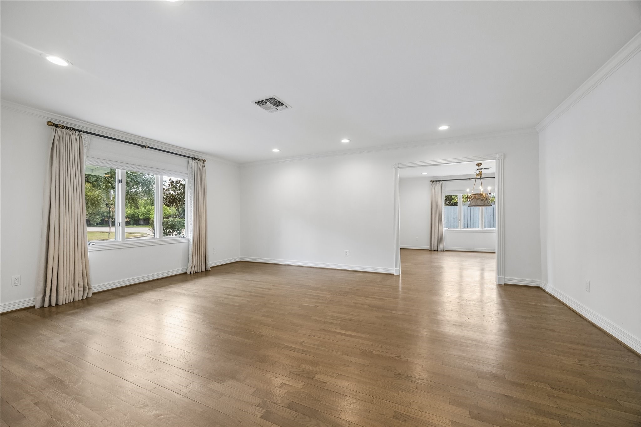 5698 Bayou Glen Road Houston, TX 77056 - Photo 2 of 30 Just off the entry, the inviting formal living room features hardwood floors, tailored drapery and a graceful transition to the adjoining formal dining room.