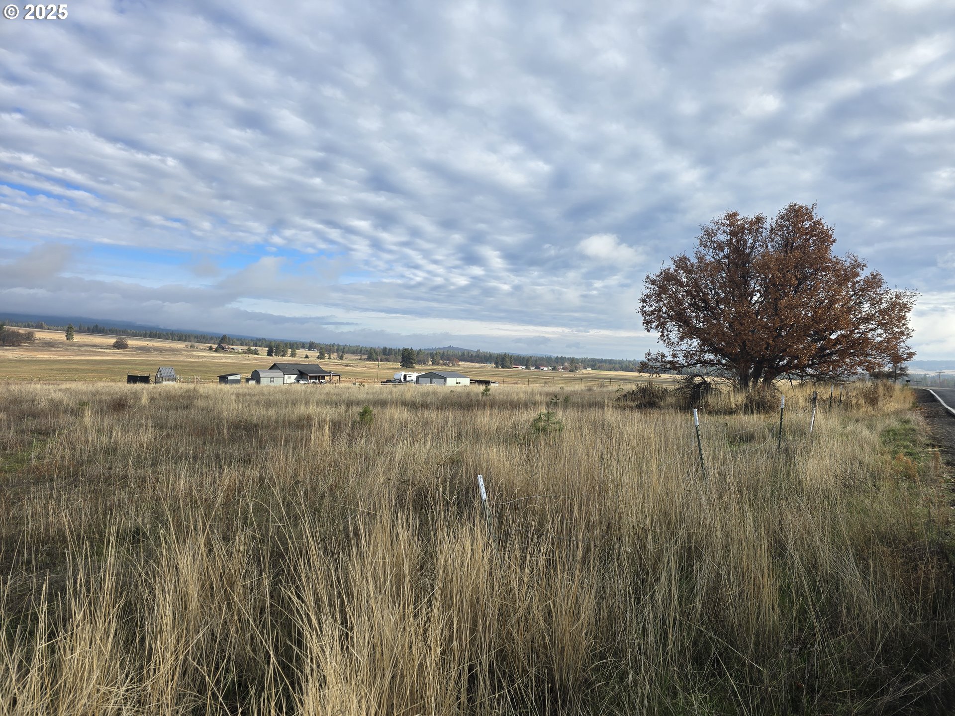 505 Foster Road Goldendale, WA 98620 - Photo 3 of 12 a view of a lake with houses in the back