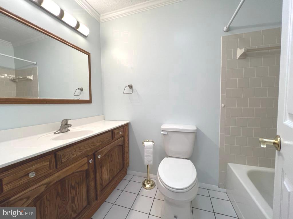 8220 Grainfield Road Severn, MD 21144 - Photo 17 of 23 a bathroom with a granite countertop toilet sink and mirror