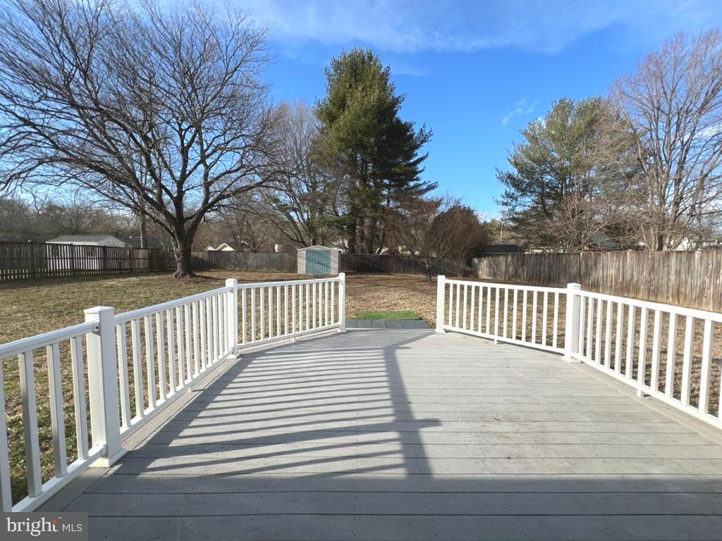 8220 Grainfield Road Severn, MD 21144 - Photo 22 of 23 a balcony with wooden floor and fence