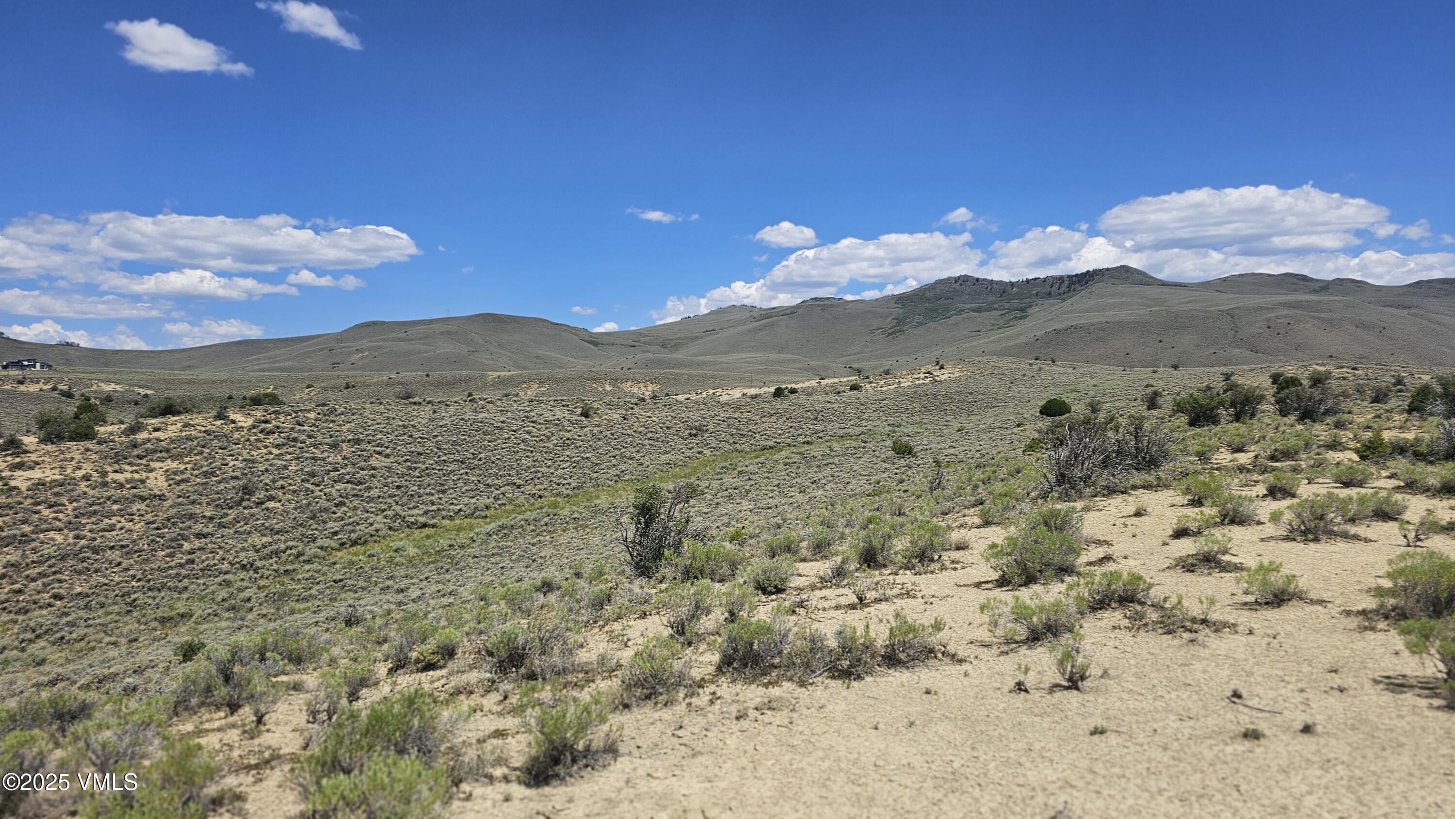 1 Horse Mountain Ranch Road Wolcott, CO 81655 - Photo 21 of 49 a view of a dry yard with wooden fence