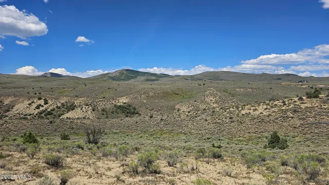 a view of mountain view with mountains in the background