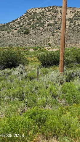 a view of a field with an outdoor space