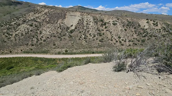 a view of a yard with a mountain