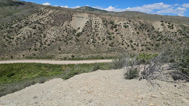 a view of a yard with a mountain