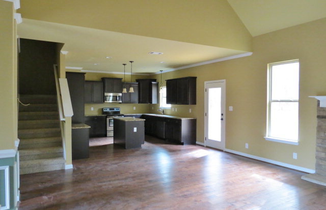 356 Walnut Grove Road Gray, GA 31032 - Photo 2 of 27 a kitchen with stainless steel appliances kitchen island granite countertop a refrigerator a sink a stove and oven with wooden floors
