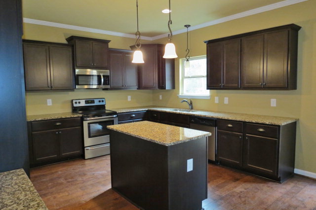 356 Walnut Grove Road Gray, GA 31032 - Photo 12 of 27 a kitchen with a sink stove and refrigerator