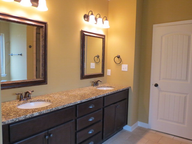 356 Walnut Grove Road Gray, GA 31032 - Photo 18 of 27 a bathroom with a granite countertop double vanity sink and a mirror