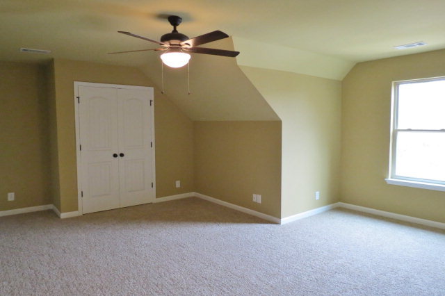 356 Walnut Grove Road Gray, GA 31032 - Photo 21 of 27 an empty room with windows and fan