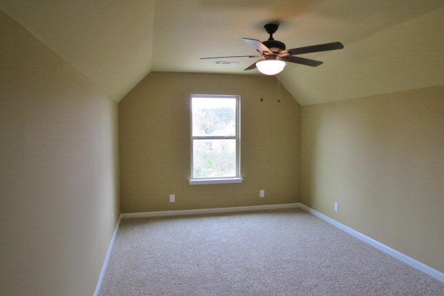 356 Walnut Grove Road Gray, GA 31032 - Photo 22 of 27 an empty room with a window and a fan