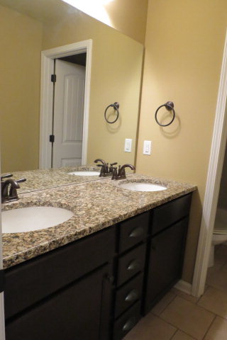 356 Walnut Grove Road Gray, GA 31032 - Photo 23 of 27 a bathroom with a granite countertop sink and a mirror