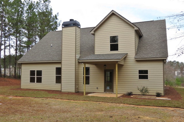 356 Walnut Grove Road Gray, GA 31032 - Photo 24 of 27 a view of a house with a yard and large tree