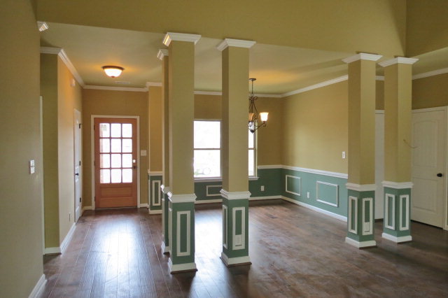 356 Walnut Grove Road Gray, GA 31032 - Photo 6 of 27 a view of a hallway with wooden floor and windows