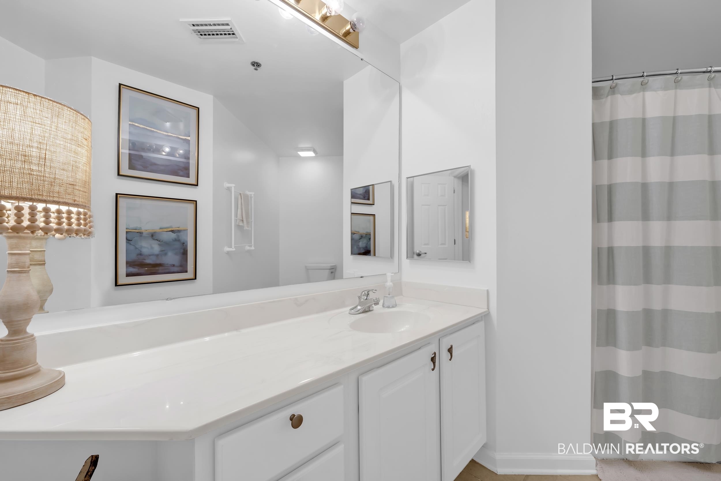 27282 Canal Road, Unit 104 Orange Beach, AL 36561 - Photo 50 of 79 Full bath featuring vanity and curtained shower