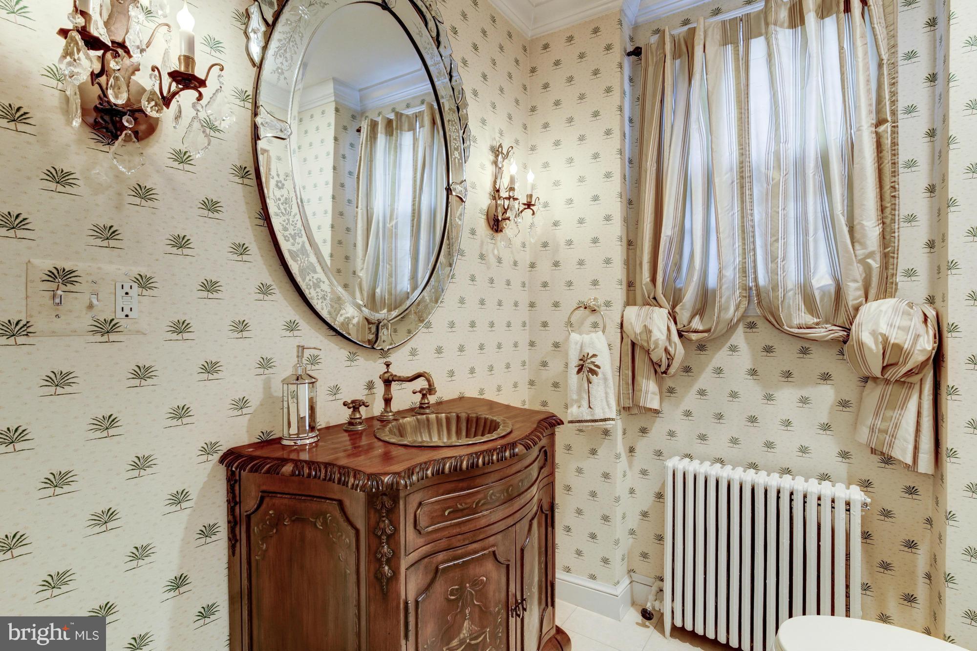 137 D Street Southeast Washington, DC 20003 - Photo 13 of 27 a bathroom with a sink a mirror and a shower curtain