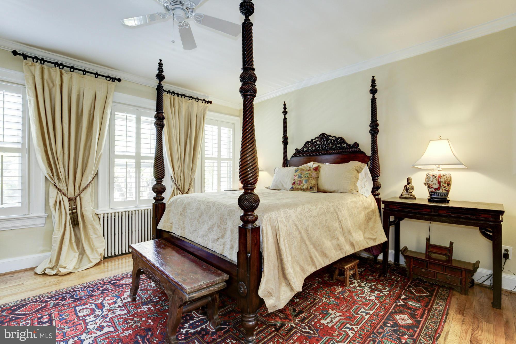 137 D Street Southeast Washington, DC 20003 - Photo 18 of 27 a bedroom with a bed and wooden floor