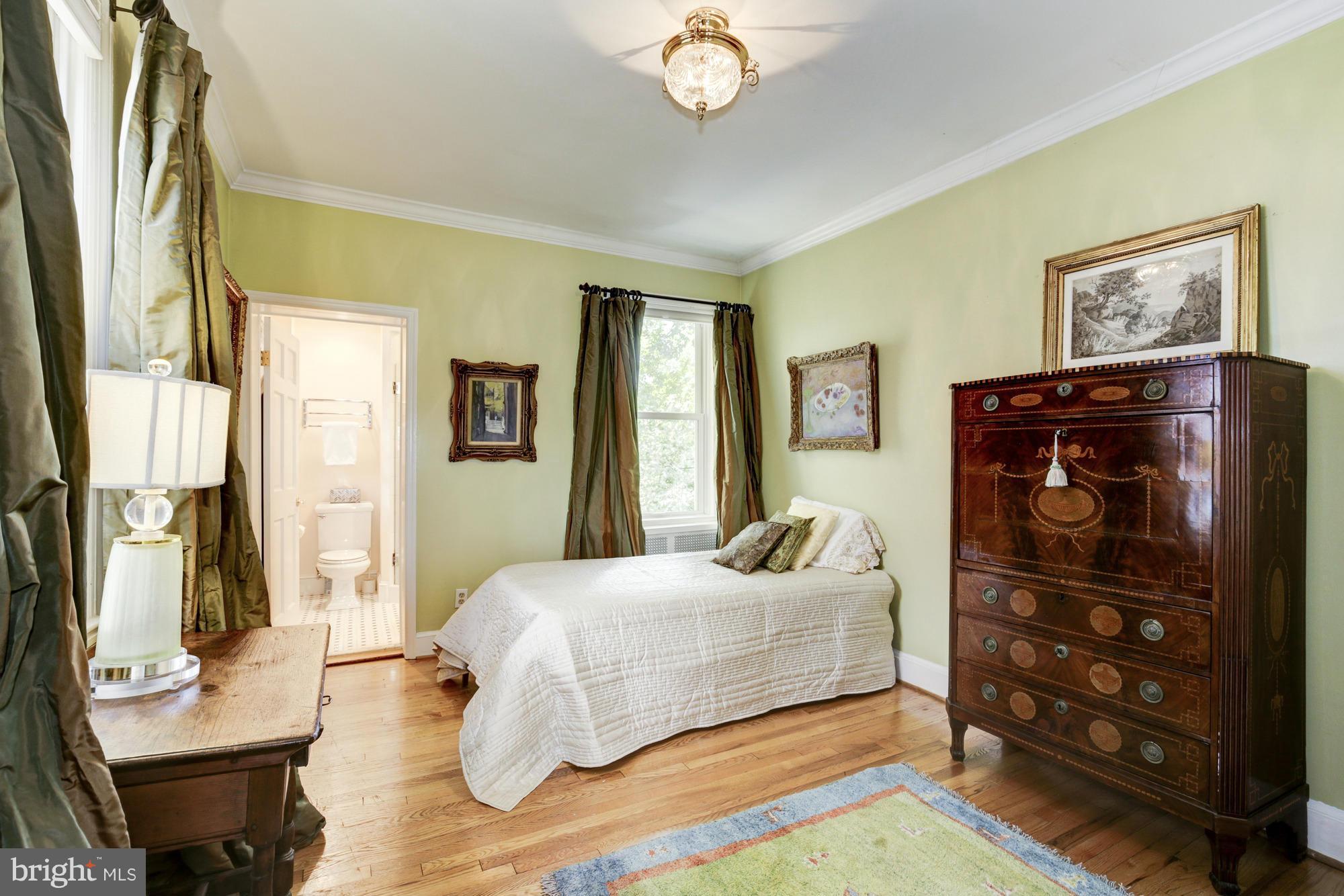 137 D Street Southeast Washington, DC 20003 - Photo 21 of 27 a bedroom with a bed and wooden floor