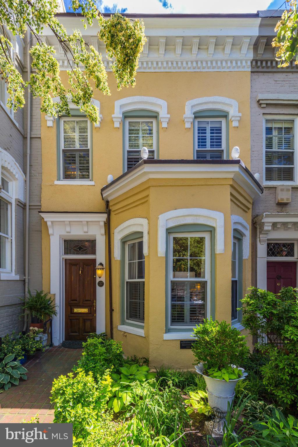 137 D Street Southeast Washington, DC 20003 - Photo 26 of 27 a view of a brick house with large windows and a large windows
