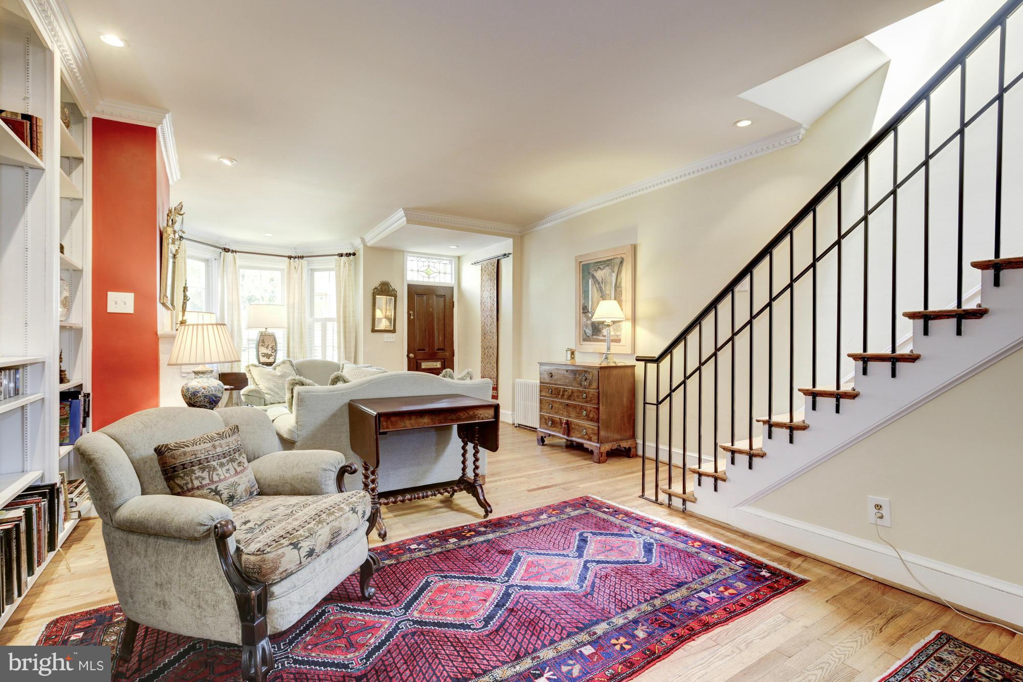 137 D Street Southeast Washington, DC 20003 - Photo 5 of 27 a living room with furniture rug and a table