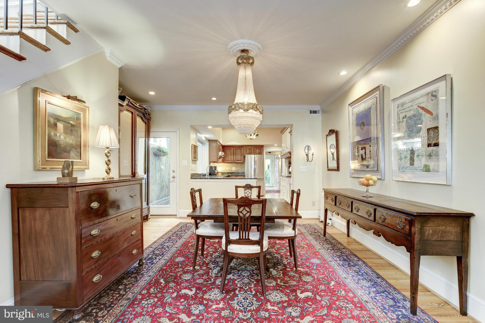 137 D Street Southeast Washington, DC 20003 - Photo 7 of 27 a dining hall with stainless steel appliances kitchen island granite countertop a table and chairs